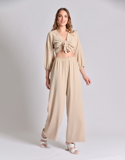 Εικόνα της Σετ μονόχρωμη παντελόνα και crop top με δέσιμο Μπεζ