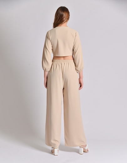 Εικόνα της Σετ μονόχρωμη παντελόνα και crop top με δέσιμο Μπεζ