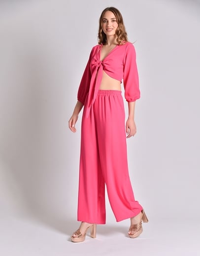 Εικόνα της Σετ μονόχρωμη παντελόνα και crop top με δέσιμο Φούξια